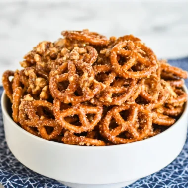 Addictive snack mix with nuts, pretzels, and chocolate for a delicious treat.