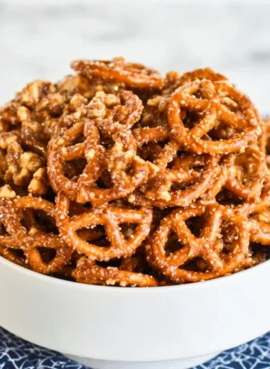 Addictive snack mix with nuts, pretzels, and chocolate for a delicious treat.