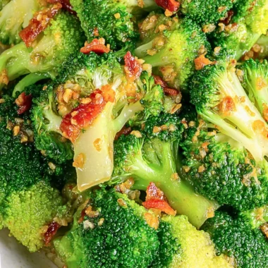 Asian broccoli with garlic sauce and crispy bacon served on a plate