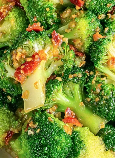 Asian broccoli with garlic sauce and crispy bacon served on a plate