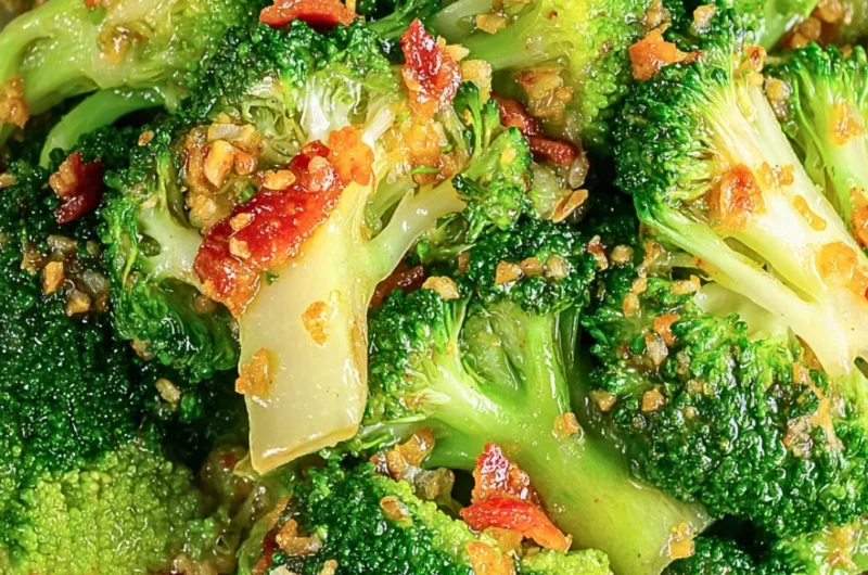 Asian broccoli with garlic sauce and crispy bacon served on a plate