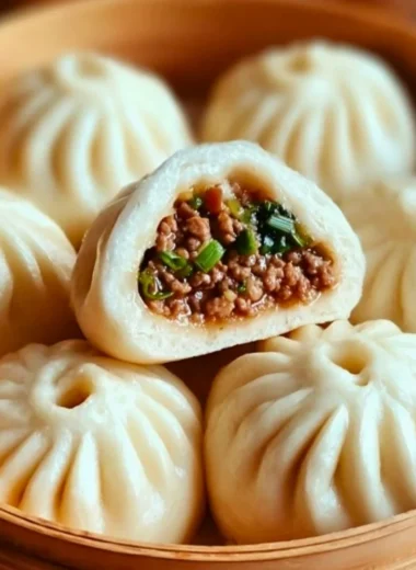 Steamed Beef Bao Buns filled with savory beef and herbs