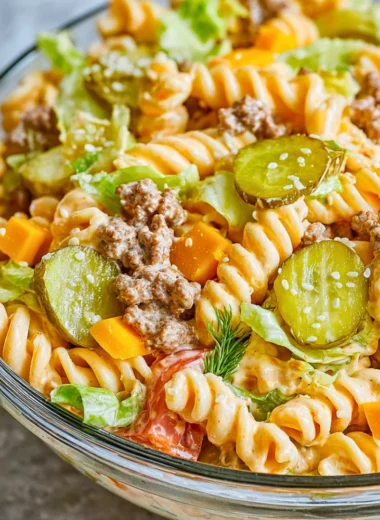 Delicious Big Mac Pasta Salad served in a bowl with fresh ingredients.