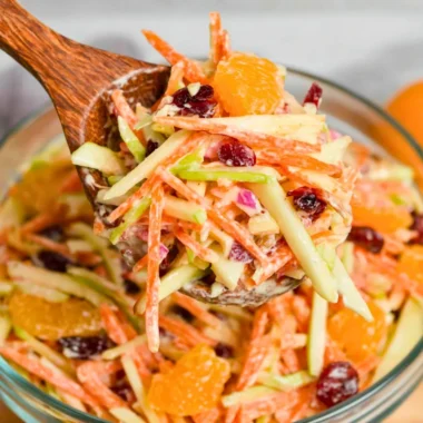 Freshly prepared Carrot Apple Salad with vibrant carrots and apples