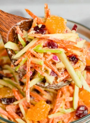 Freshly prepared Carrot Apple Salad with vibrant carrots and apples
