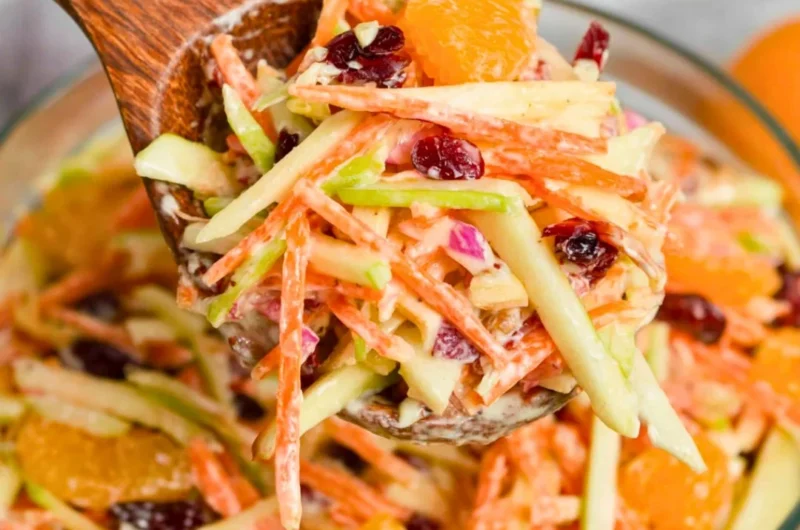 Freshly prepared Carrot Apple Salad with vibrant carrots and apples