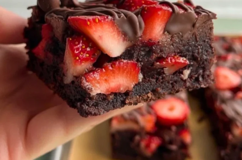 Chocolate covered strawberry brownies topped with fresh strawberries