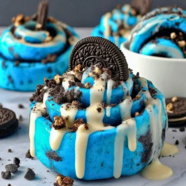 Delicious Cookie Monster Cinnamon Rolls with blue swirl icing