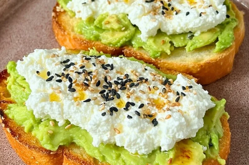 Delicious cottage cheese toast topped with fresh herbs and seasonings.