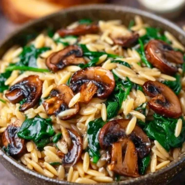 Garlic Butter Orzo with Mushrooms and Spinach served in a bowl