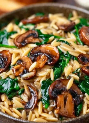Garlic Butter Orzo with Mushrooms and Spinach served in a bowl