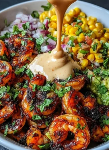 Grilled shrimp bowl with avocado, corn salsa and creamy garlic sauce