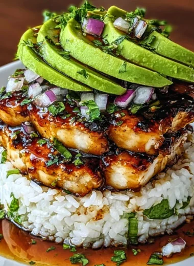 Delicious Honey Lime Chicken and Avocado Rice Stack served on a plate