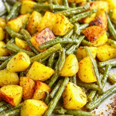 Oven-roasted potatoes and green beans on a serving platter