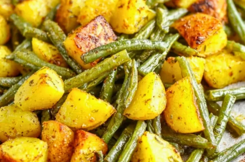 Oven-roasted potatoes and green beans on a serving platter