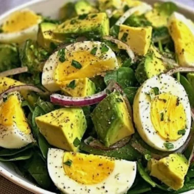 Power salad with avocado, egg, and spinach in a healthy fuel bowl