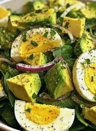 Power salad with avocado, egg, and spinach in a healthy fuel bowl