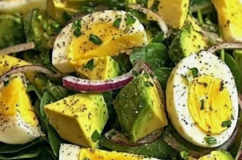Power salad with avocado, egg, and spinach in a healthy fuel bowl