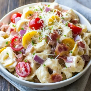 Delicious Grinder Tortellini Salad featuring colorful ingredients in a bowl