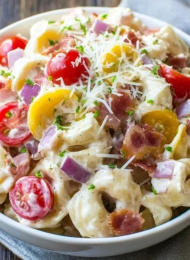 Delicious Grinder Tortellini Salad featuring colorful ingredients in a bowl