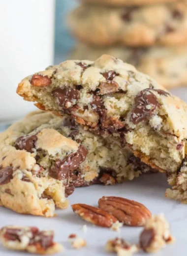 Freshly baked oatmeal chocolate chip cookies on a cooling rack