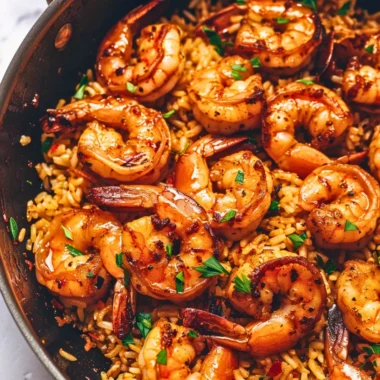 Delicious Cajun shrimp and rice skillet topped with fresh herbs.