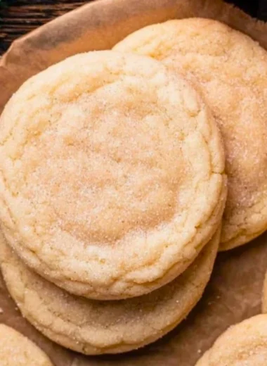 Chewy sugar cookies with a soft texture and sweet flavor on a baking tray