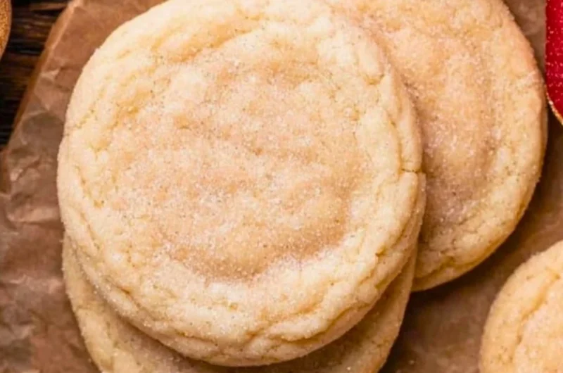 Chewy sugar cookies with a soft texture and sweet flavor on a baking tray