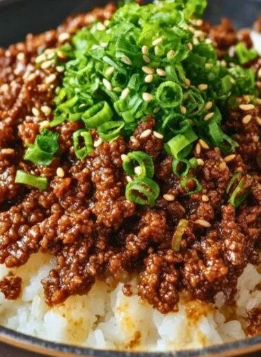 Delicious Korean Ground Beef Bowl topped with fresh vegetables and sesame seeds.