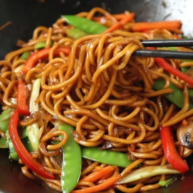 Delicious plate of Lo Mein noodles with vegetables and sauces