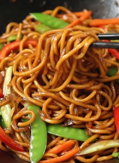 Delicious plate of Lo Mein noodles with vegetables and sauces