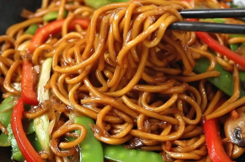 Delicious plate of Lo Mein noodles with vegetables and sauces