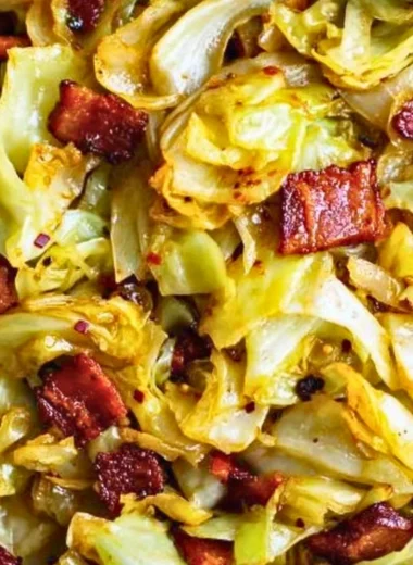 Delicious Southern Fried Cabbage served in a skillet with spices and seasonings.