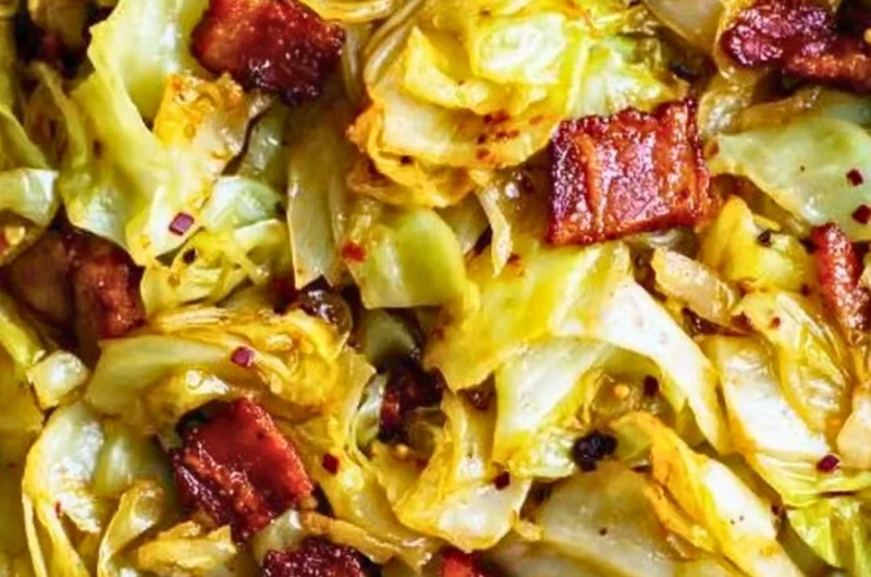 Delicious Southern Fried Cabbage served in a skillet with spices and seasonings.