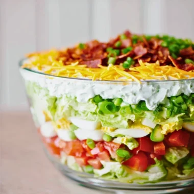Colorful and fresh 7 Layer Salad arranged in layers.