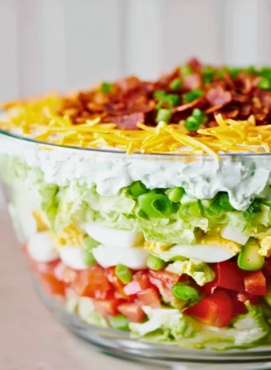Colorful and fresh 7 Layer Salad arranged in layers.