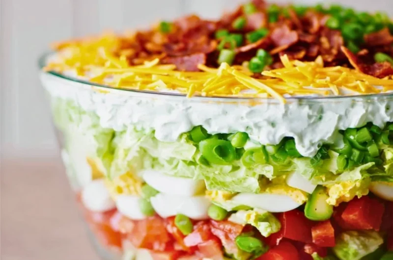 Colorful and fresh 7 Layer Salad arranged in layers.
