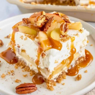 Delicious Apple Delight dessert layered with graham cracker crust and creamy filling