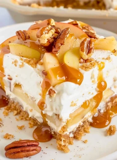 Delicious Apple Delight dessert layered with graham cracker crust and creamy filling
