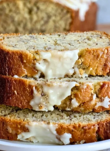 Delicious slice of homemade banana bread on a wooden table