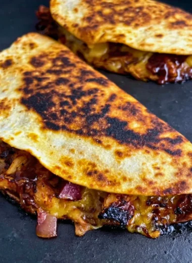 Delicious Blackstone hot honey BBQ chicken quesadillas served on a platter