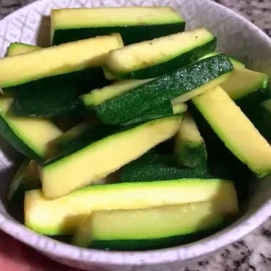 Plate of crispy Keto Zucchini Fries garnished with herbs