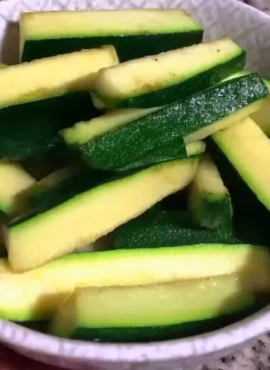 Plate of crispy Keto Zucchini Fries garnished with herbs
