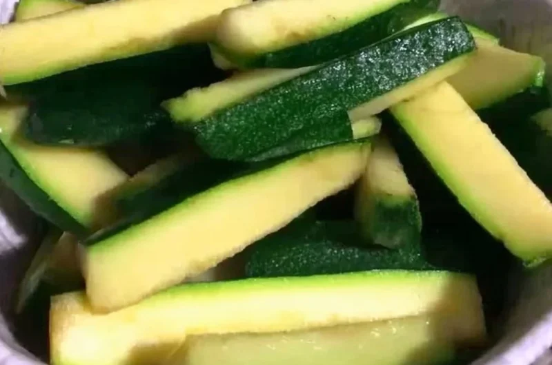Plate of crispy Keto Zucchini Fries garnished with herbs