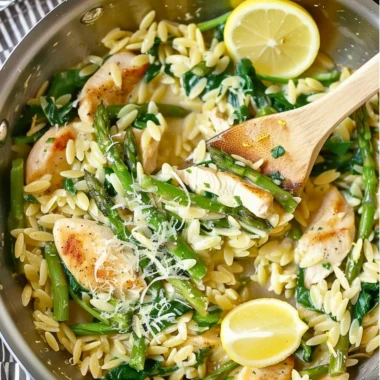 One Pot Lemon and Chicken Orzo dish garnished with fresh herbs