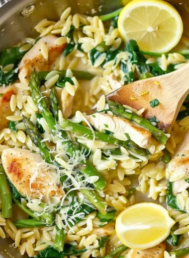 One Pot Lemon and Chicken Orzo dish garnished with fresh herbs