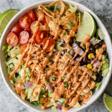Delicious Taco Chicken Salad with fresh vegetables and chicken served in a bowl.