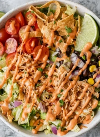 Delicious Taco Chicken Salad with fresh vegetables and chicken served in a bowl.