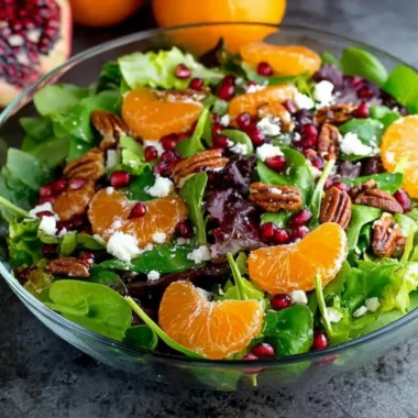 Colorful winter salad with fresh greens, nuts, and seasonal vegetables