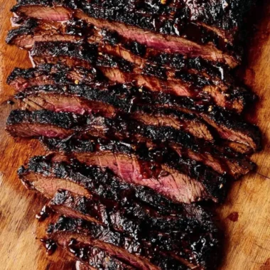 Balsamic flank steak served with grilled zucchini and creamy whipped feta.